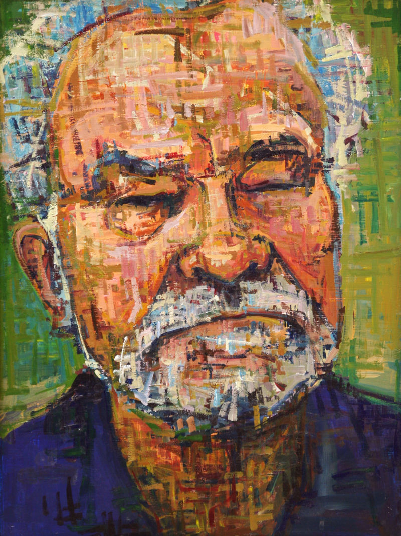 portrait of a man with a white beard frowning pensively
